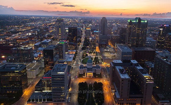 Gateway Arch. As the sun sets the city shines in a different light