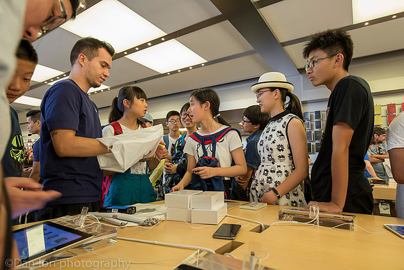 Apple flagship store, 5th Ave.  NYC. Making sales.