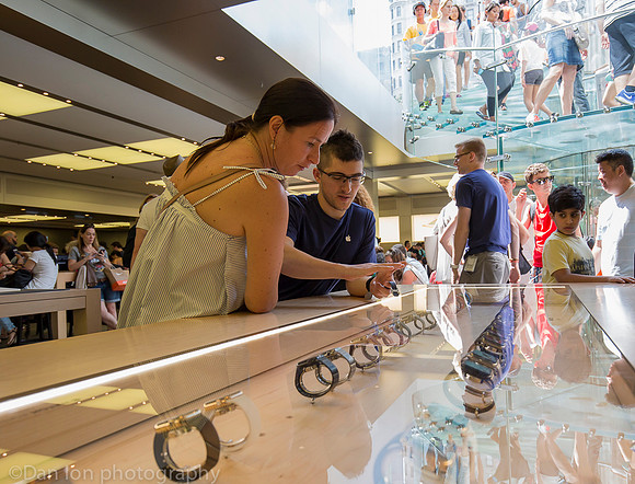 Apple flagship store, 5th Ave.  NYC. Looking at the Apple watch.