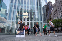 Apple flagship store, 5th Ave.  NYC. Happy customer.